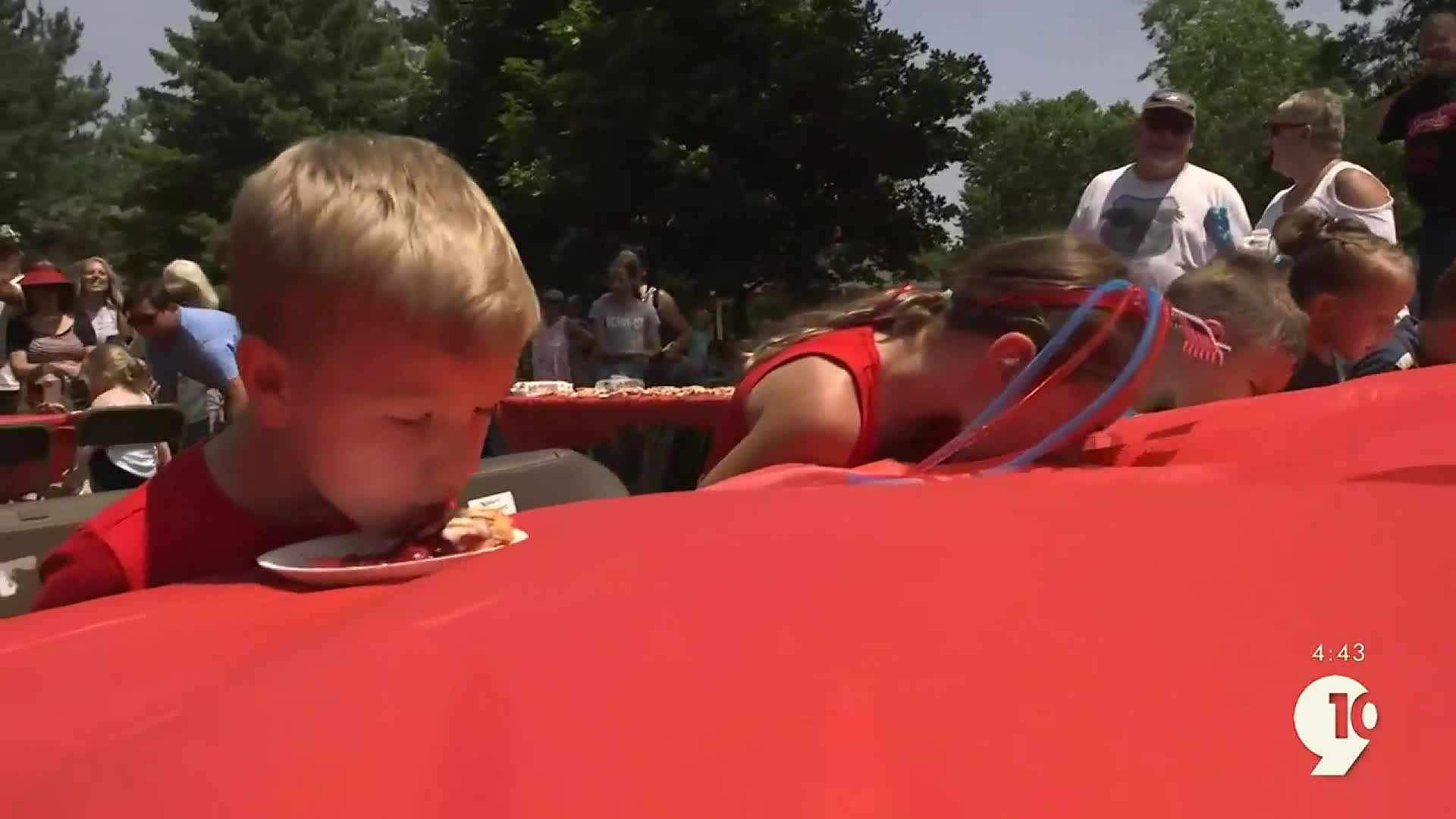 Chowing down at the Kids Cherry Pie Eating Contest at the National